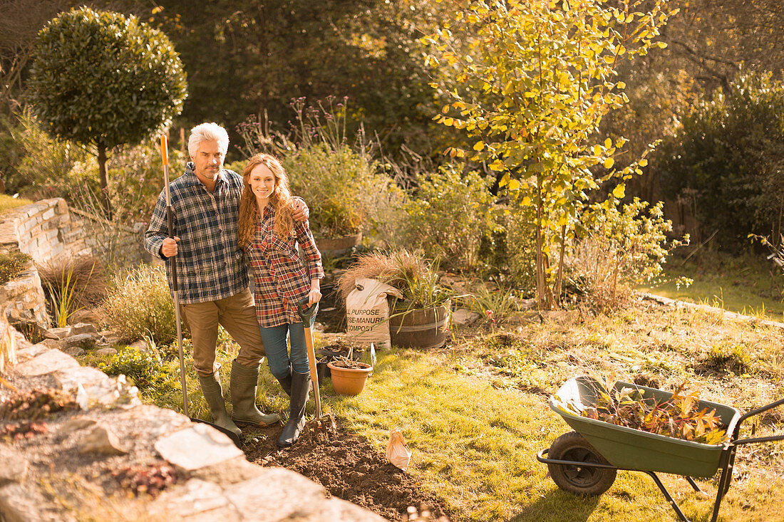 Portrait smiling couple gardening