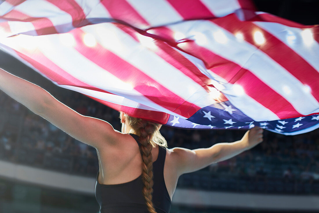 Female athlete with American flag