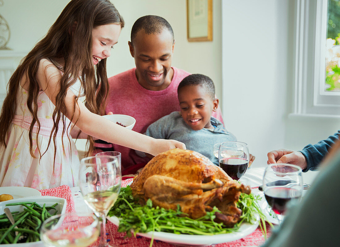 Family enjoying Christmas turkey dinner
