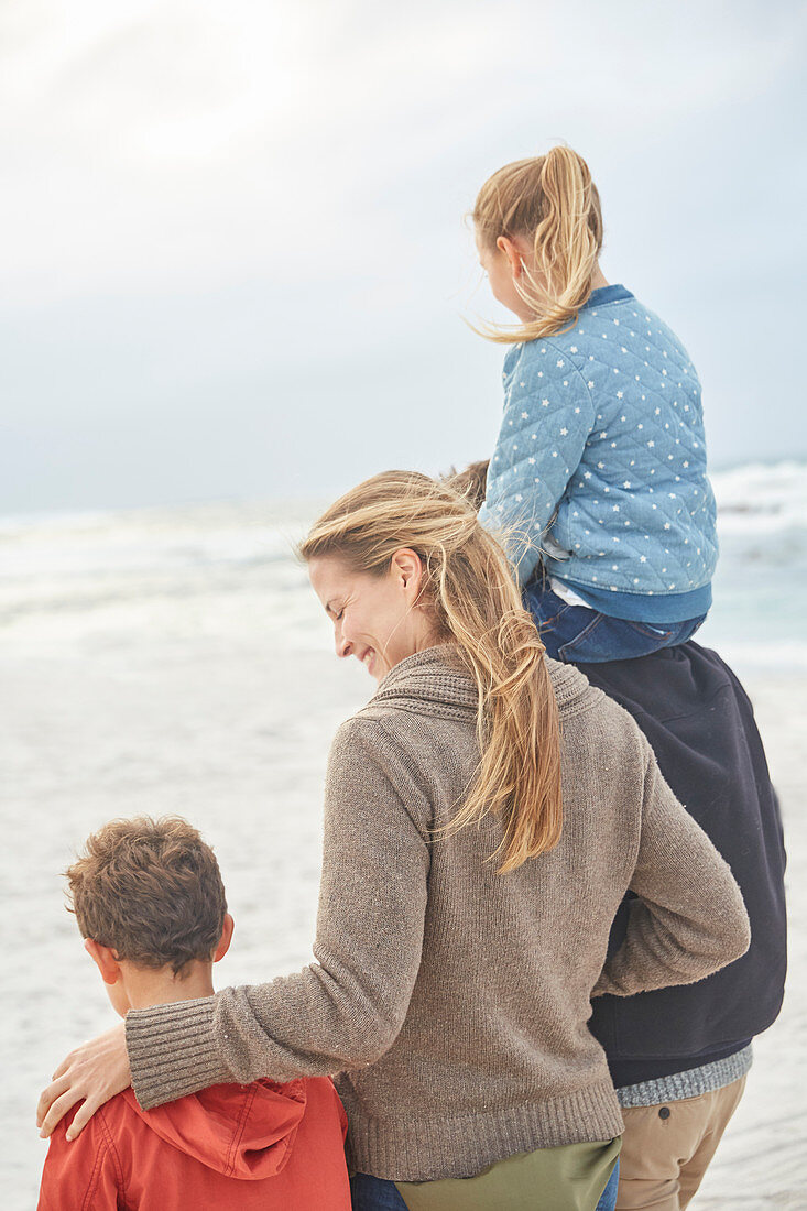 Family walking on winter beach