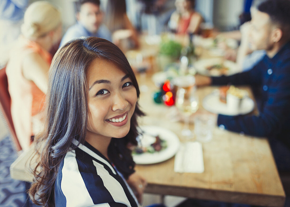 Portrait Woman dining with friends