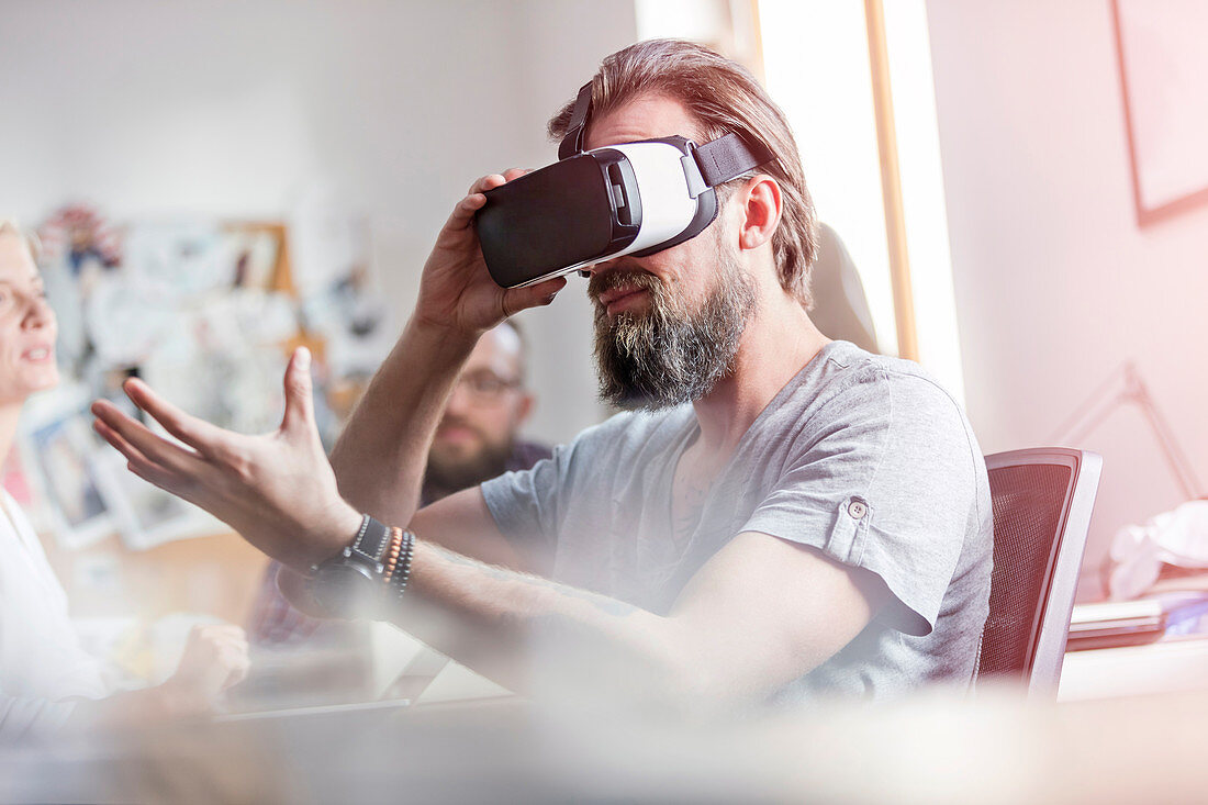 Male designer using virtual reality glasses
