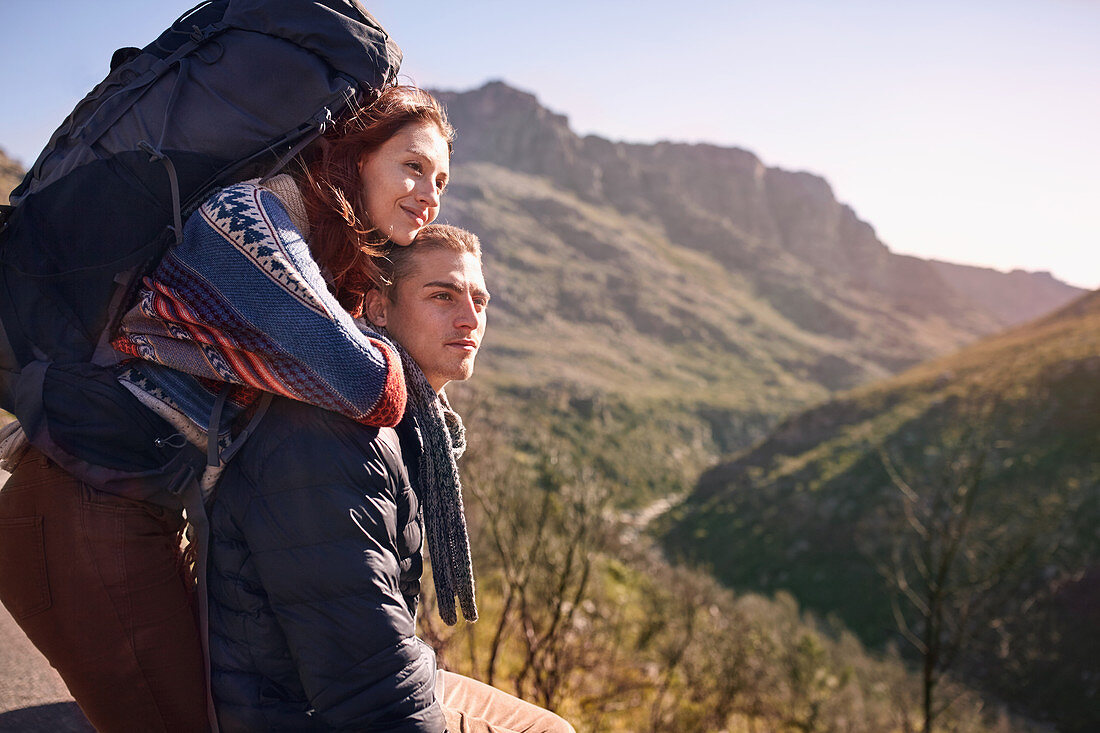 Young couple with backpack hiking