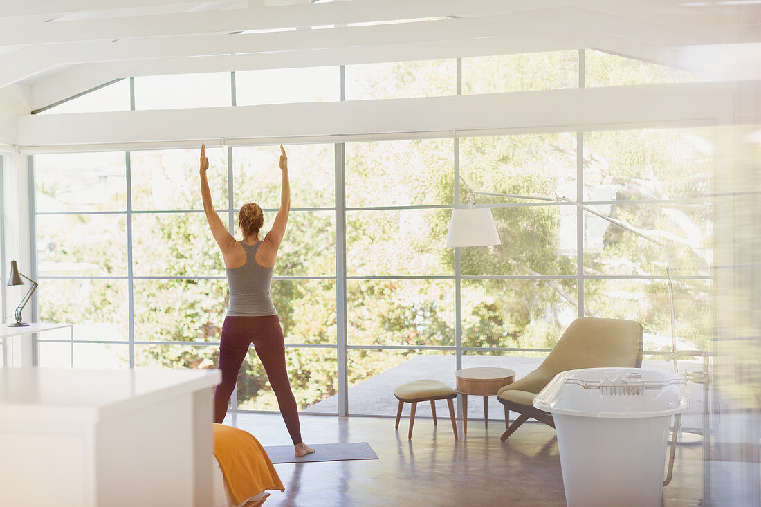 Woman practicing yoga mountain pose