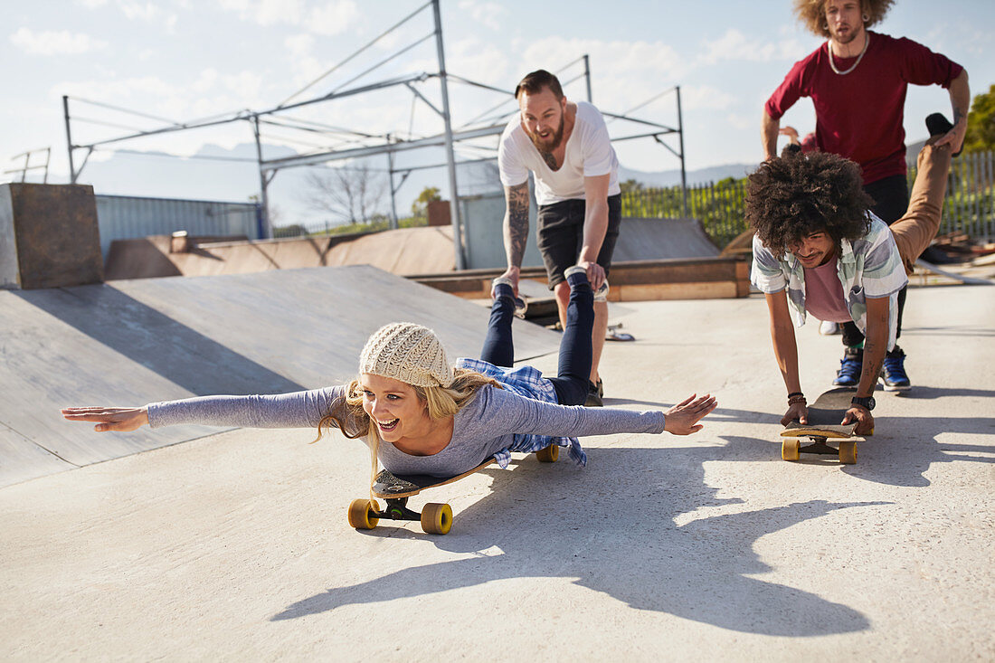 Playful friends on skateboards