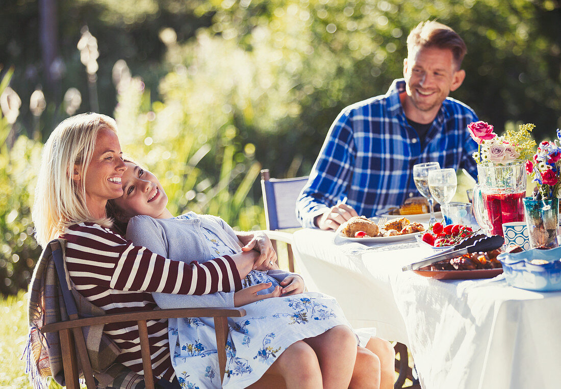 Smiling affectionate family enjoying lunch