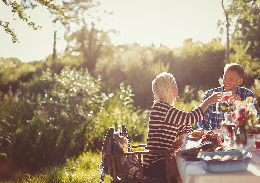 Couple toasting wine glasses