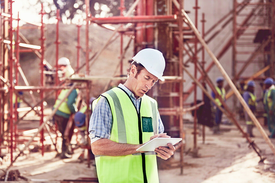 Construction worker using tablet