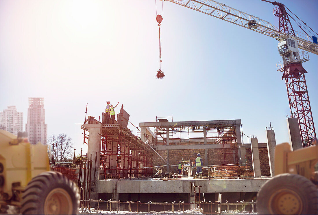 Crane over construction workers