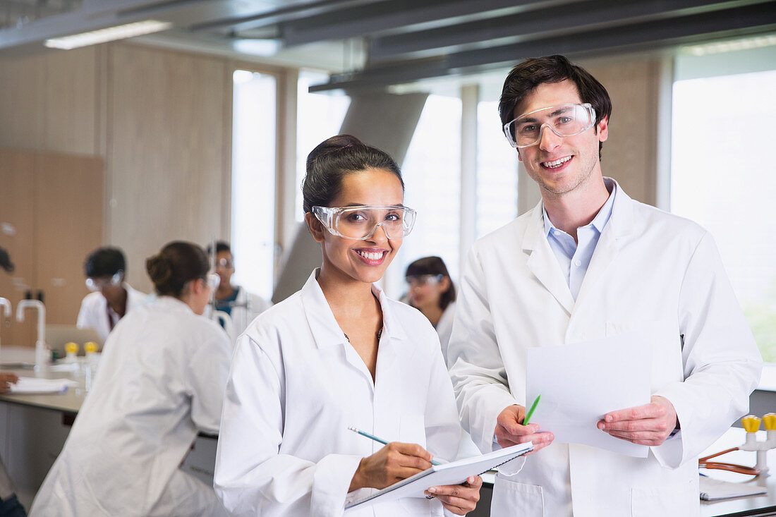 Portrait college students in lab coats