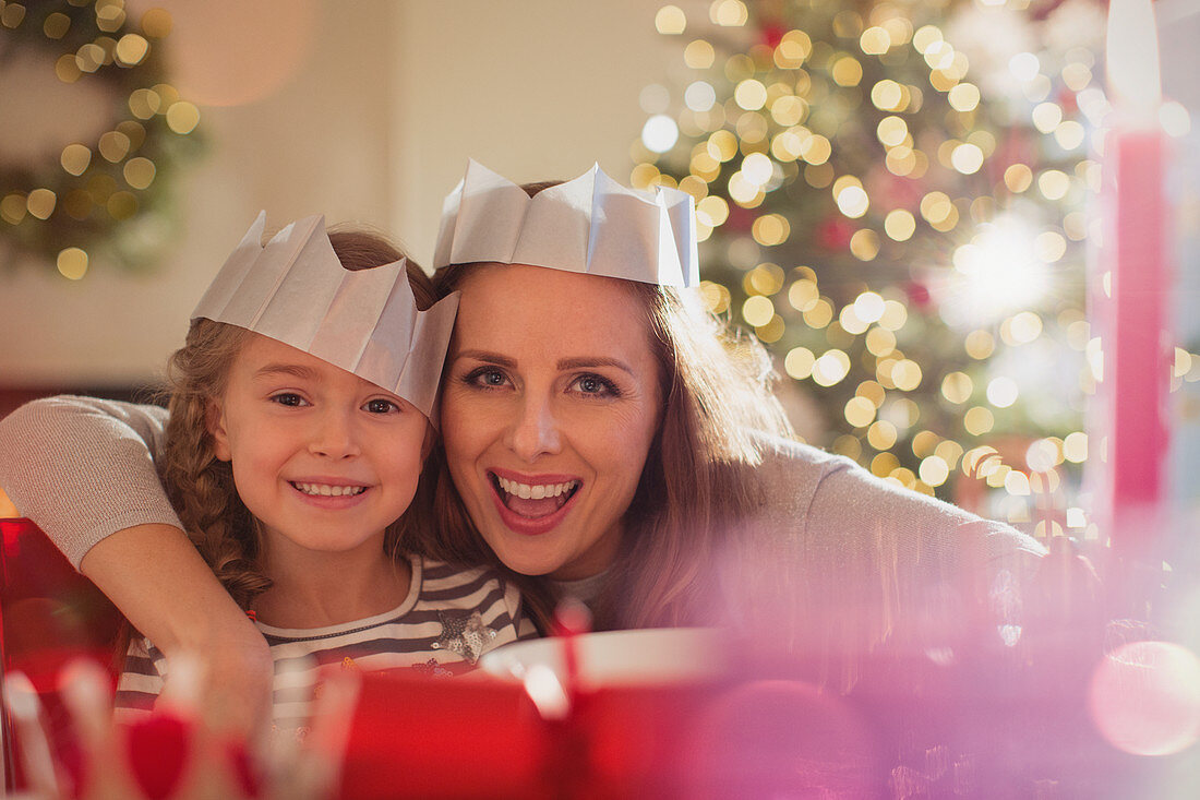 Mother and daughter in paper crowns