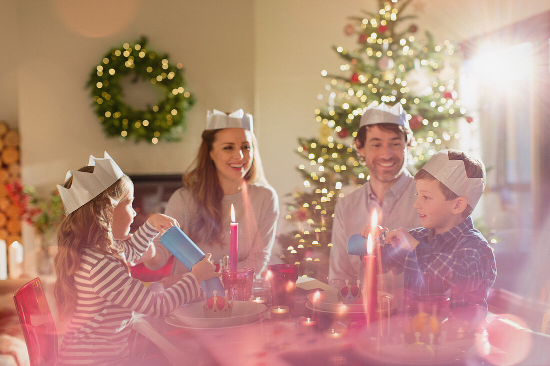 Family wearing paper crowns