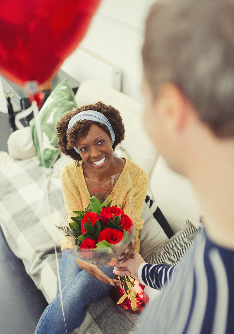 Husband giving Valentine's Day gifts to wife