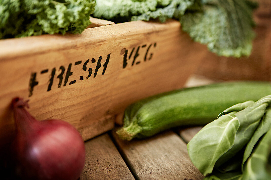 Fresh vegetables and wooden crate
