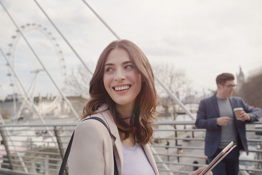 Smiling woman walking, London, UK