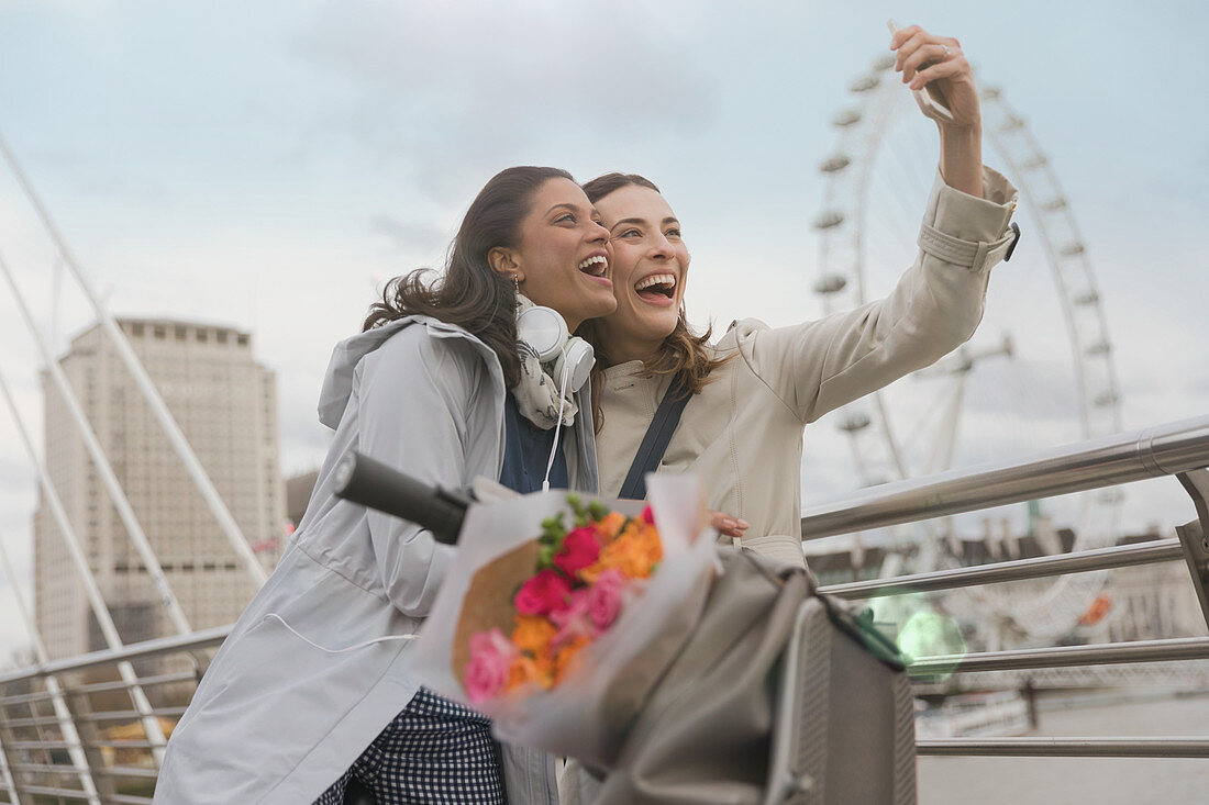 Women friends taking selfie, London, UK