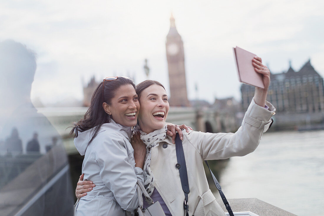 Women friend tourists taking selfie, London, UK