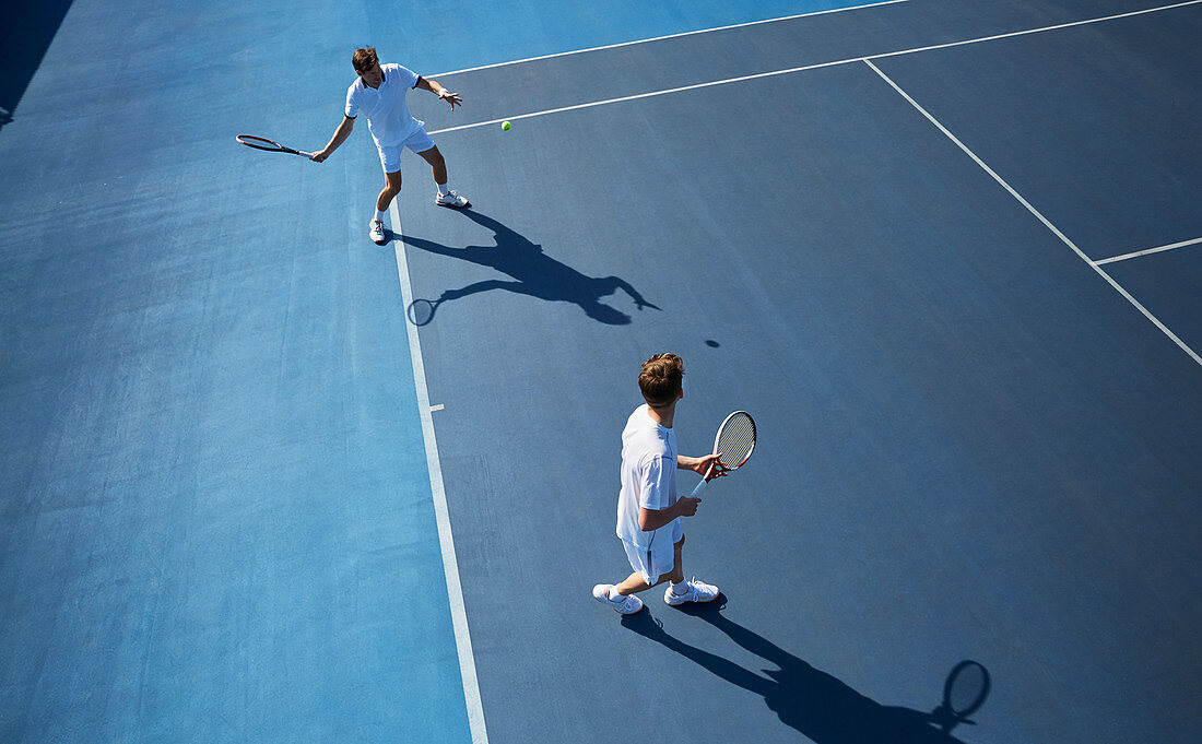 Young doubles tennis players playing tennis