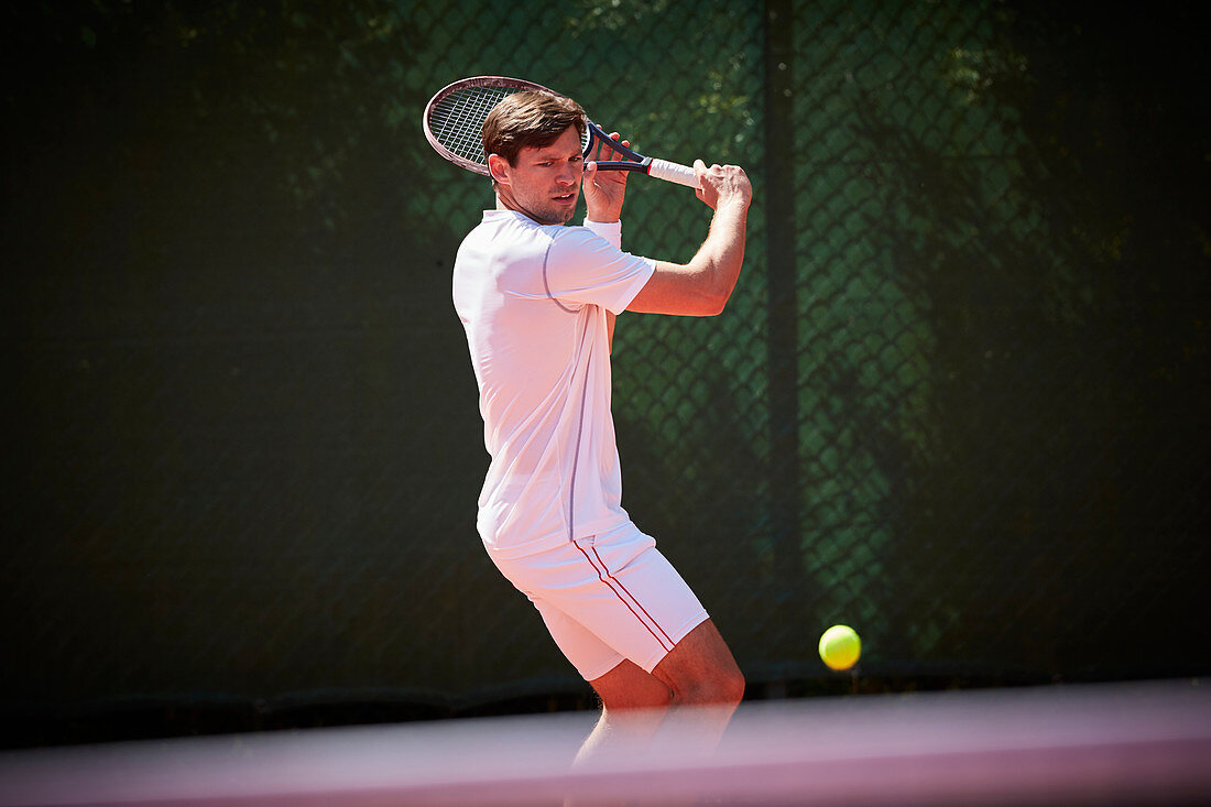 Young tennis player playing tennis