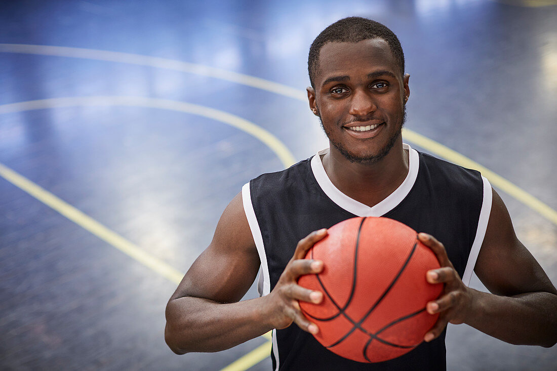 Portrait basketball player holding basketball