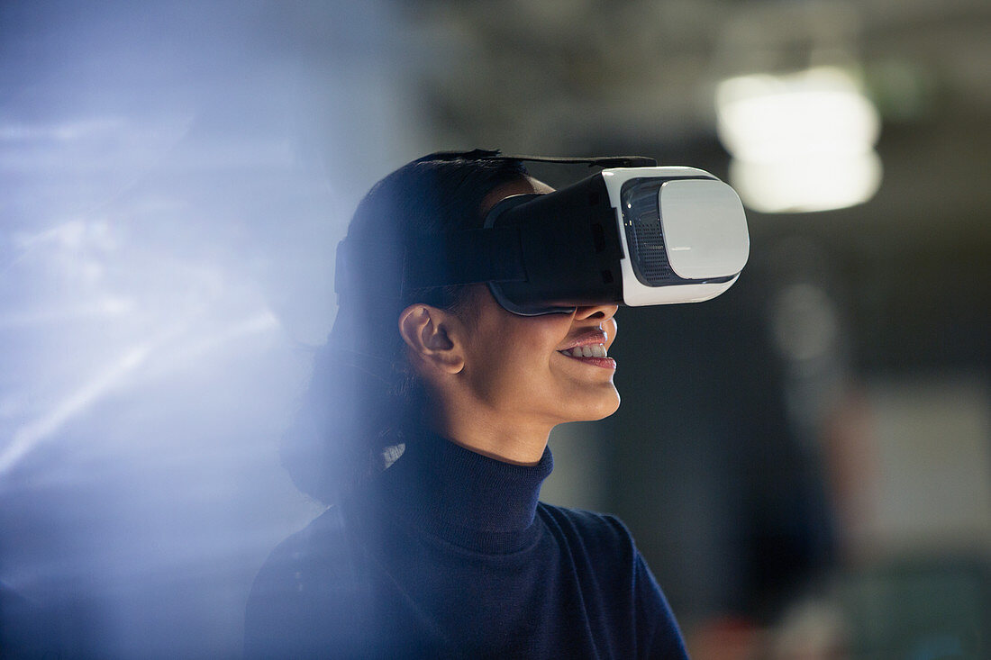 Businesswoman using VR simulator