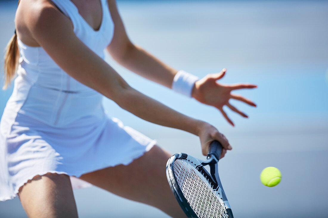 Female tennis player playing tennis