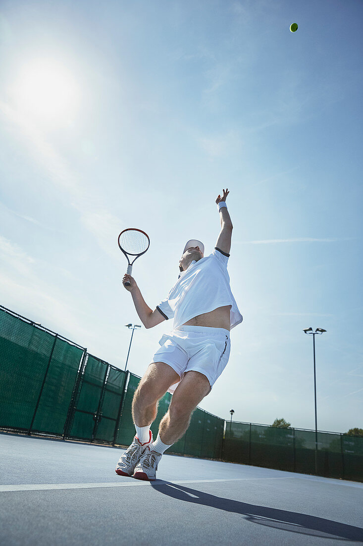 Young tennis player playing tennis