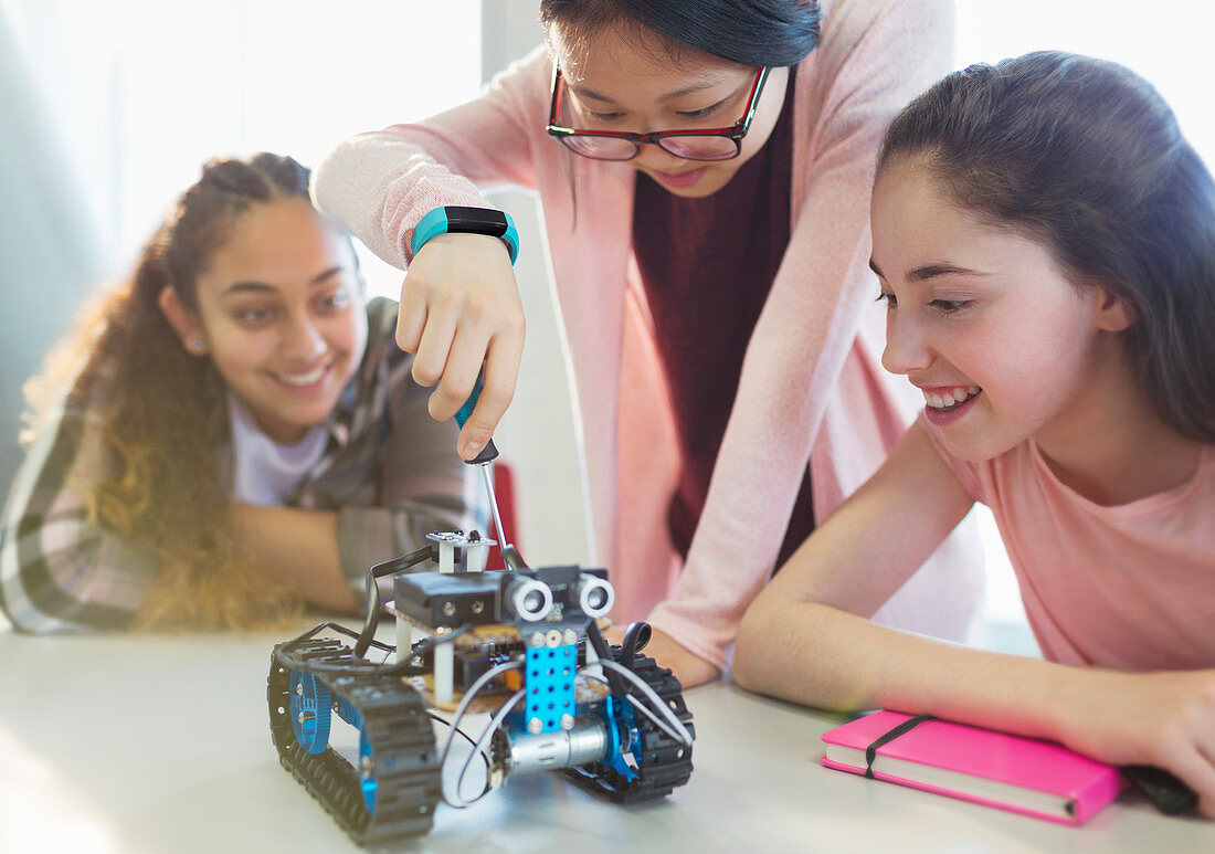 Girl students assembling robotics