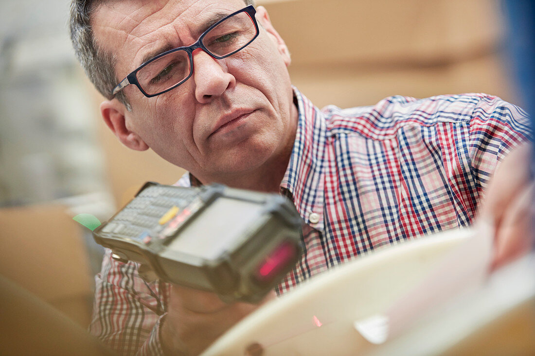 Focused worker using IR code scanner