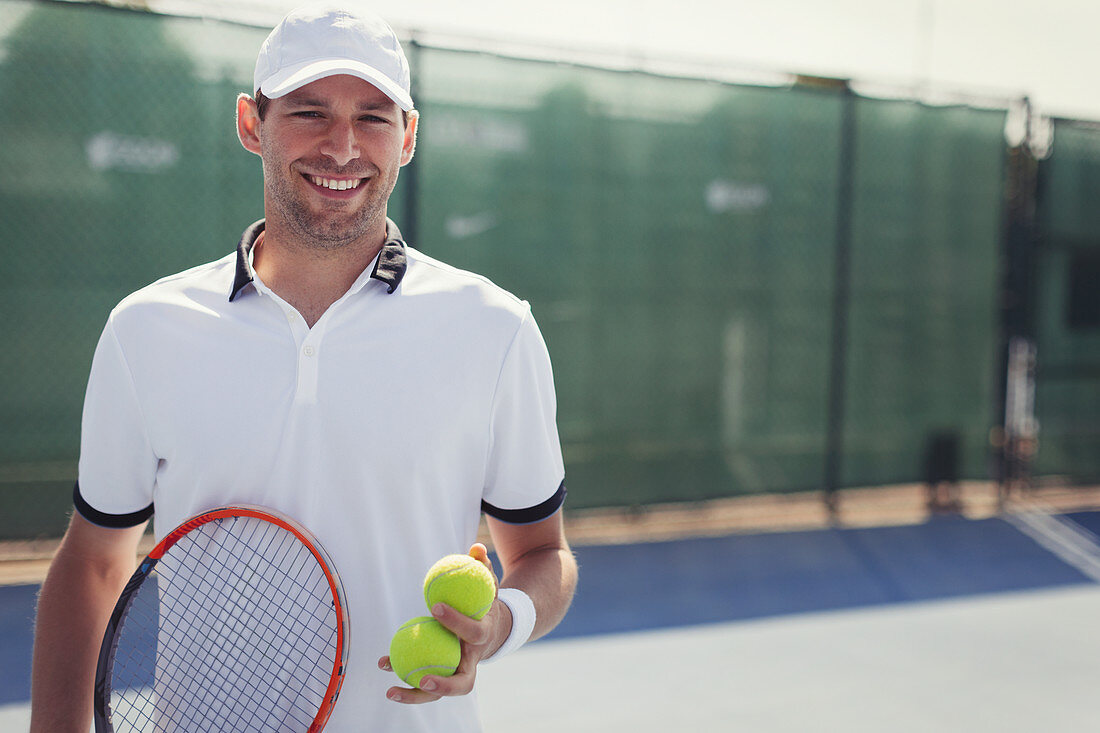Portrait tennis player holding tennis racket