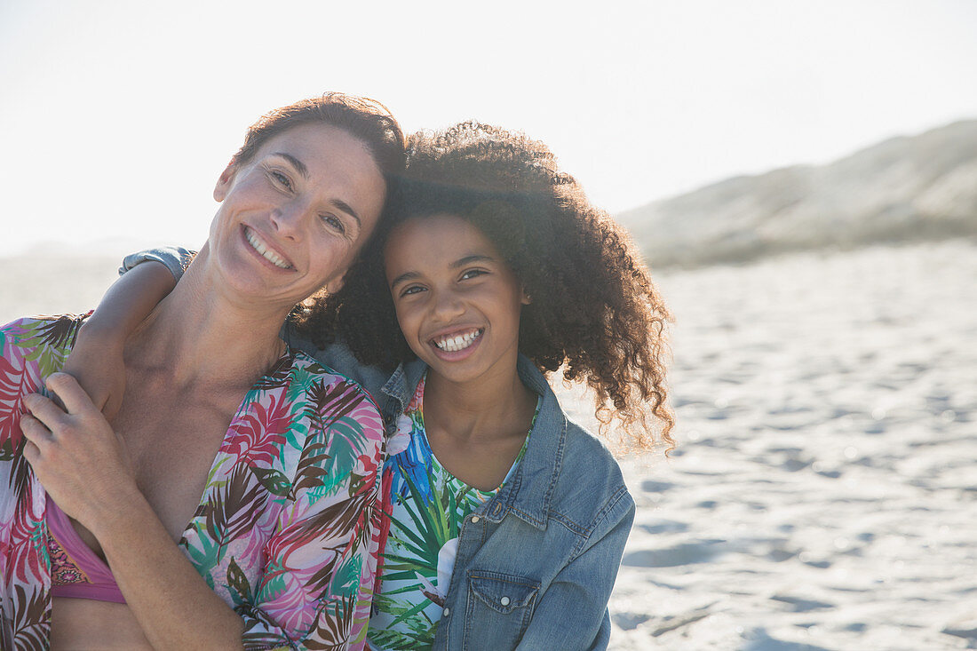 Portrait mother and daughter hugging