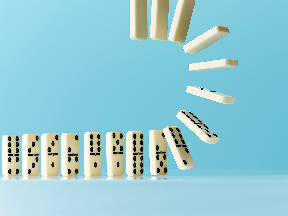 Flipping dominos on blue background