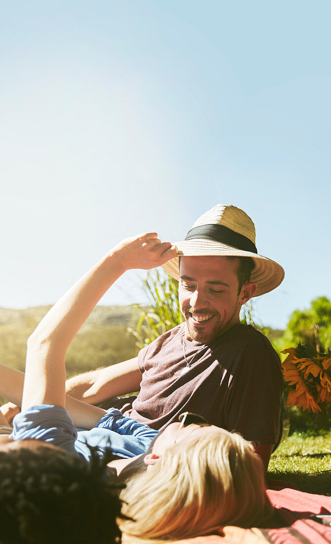 Couple relaxing in sunny summer park