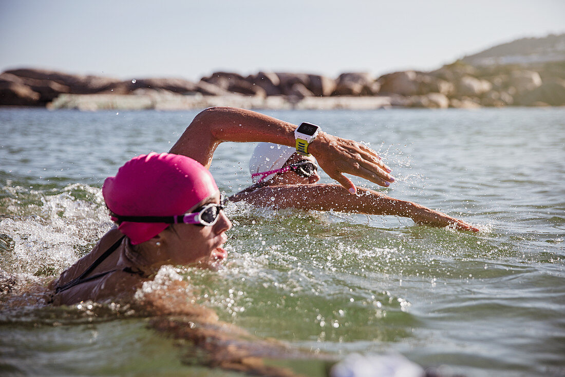 Female swimmer with smart watch swimming