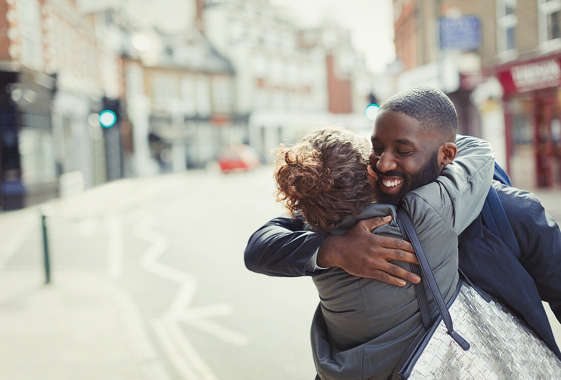 Happy, affectionate couple hugging