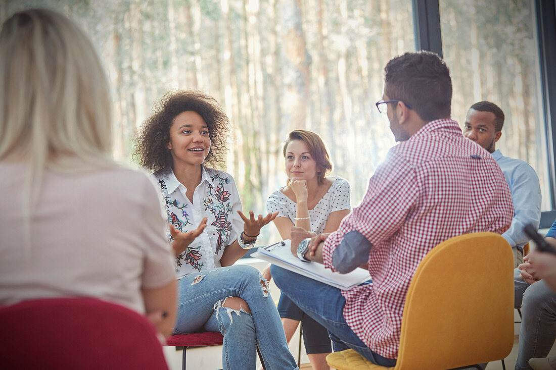 Woman talking in group therapy session
