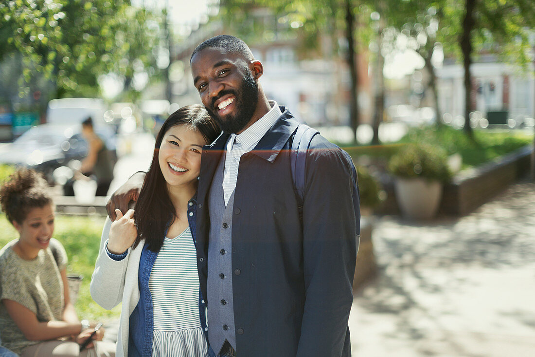 Portrait smiling, affectionate couple hugging