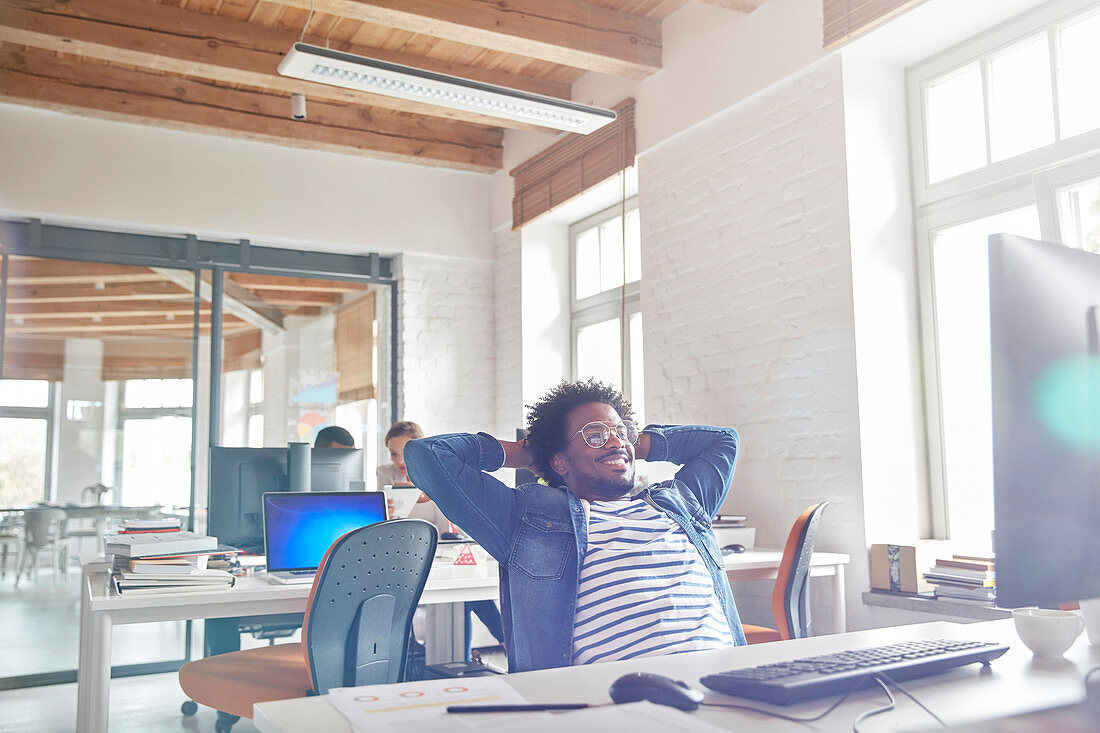 Confident businessman leaning