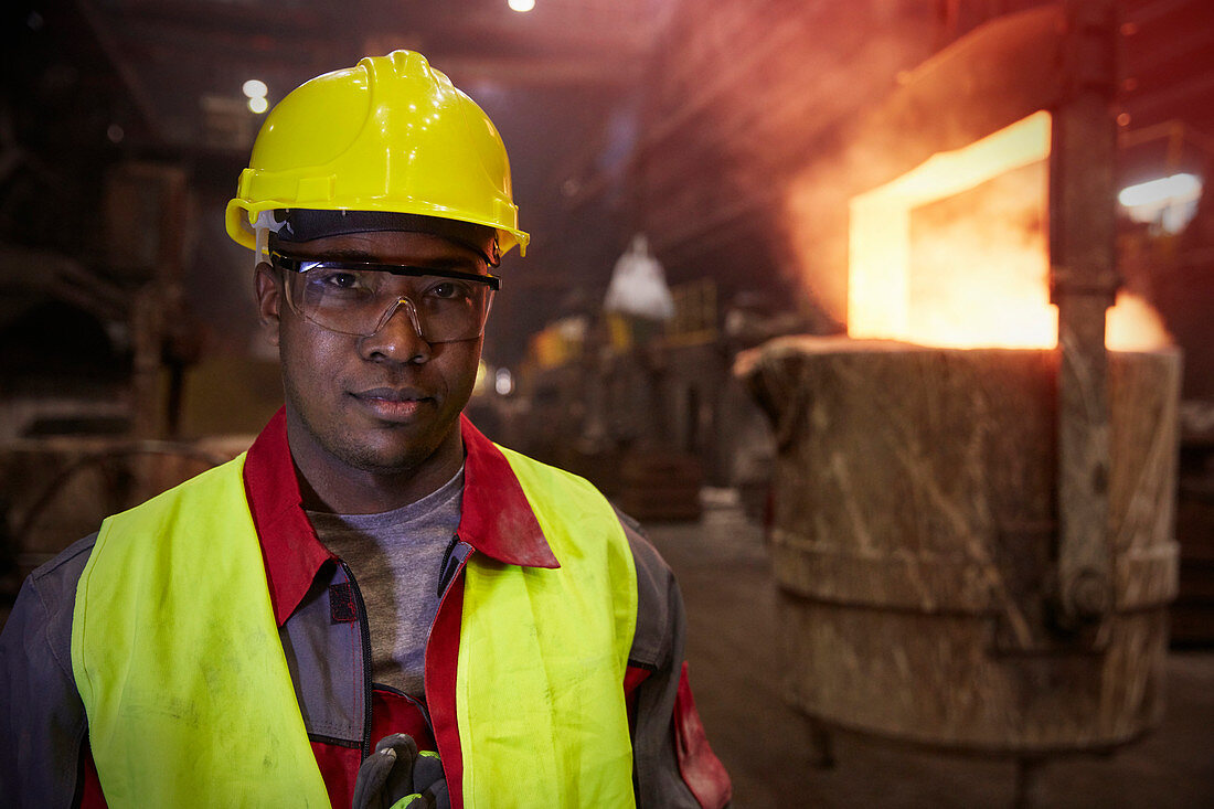 Portrait serious steelworker in steel mill