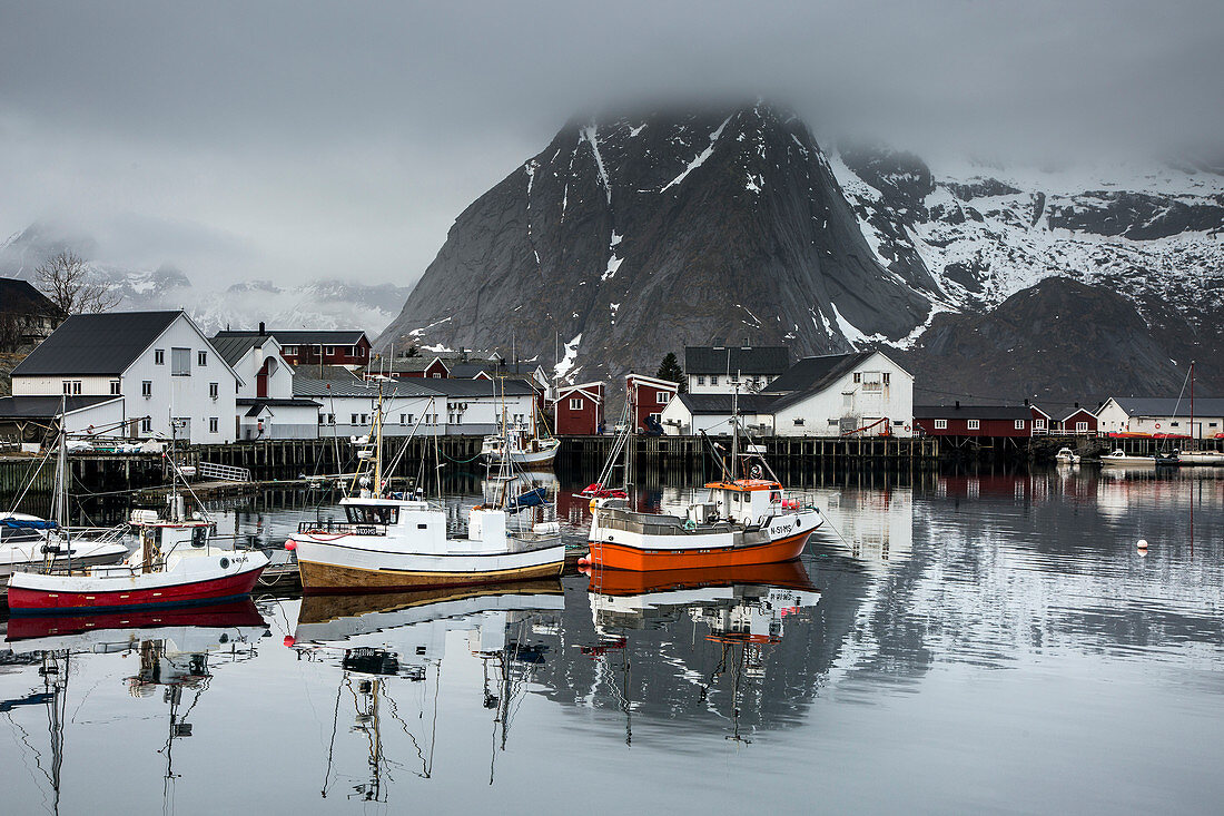 Fishing boats and village at waterfront, Norway