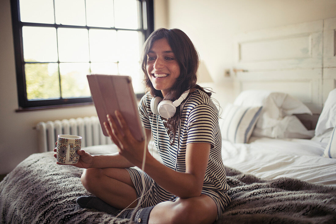 Smiling woman using tablet