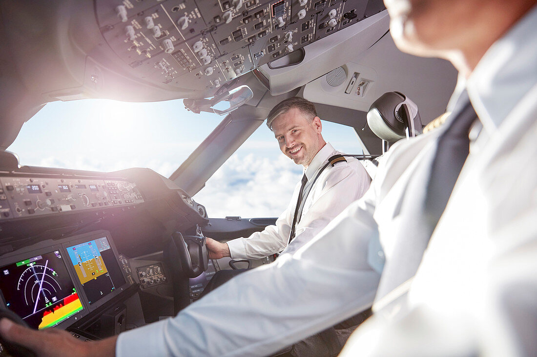 Portrait pilot in airplane cockpit