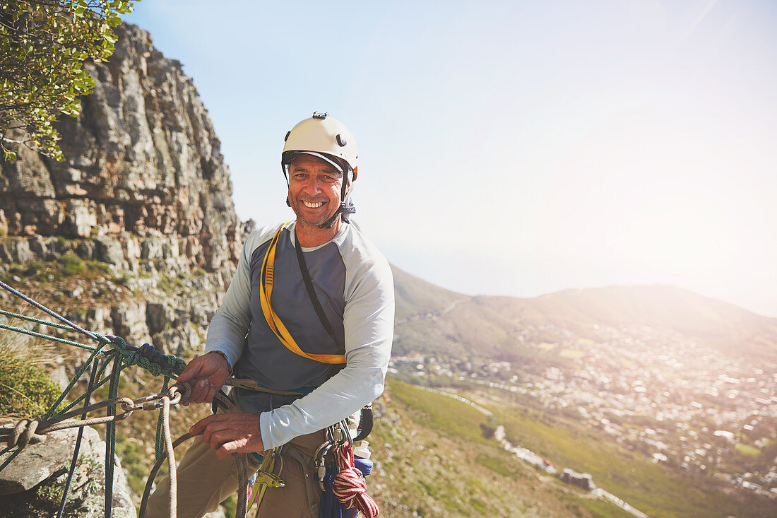 Portrait smiling, confident rock climber