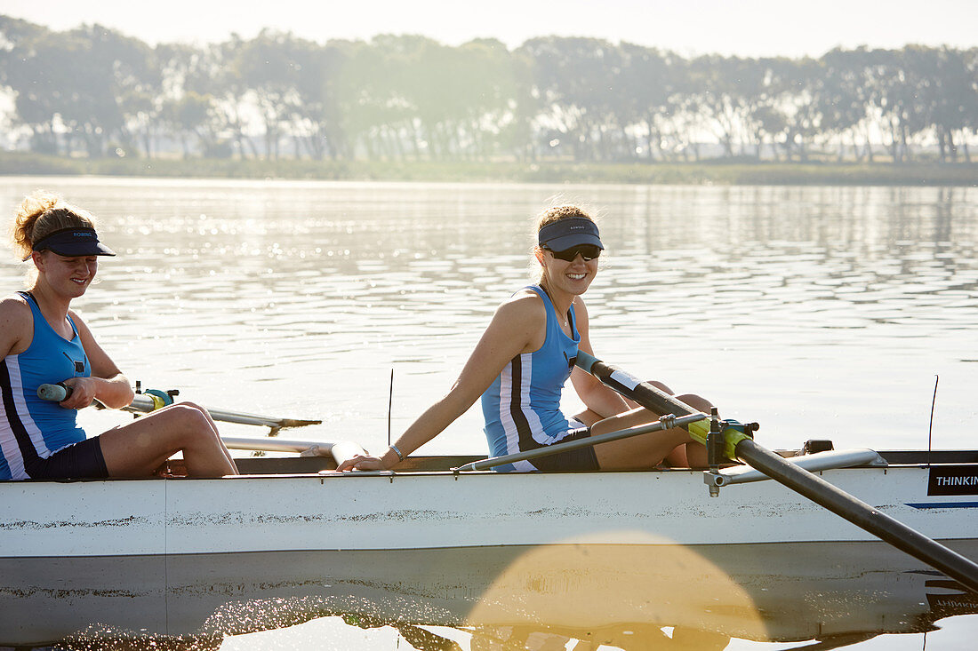 Portrait smiling rower in scull