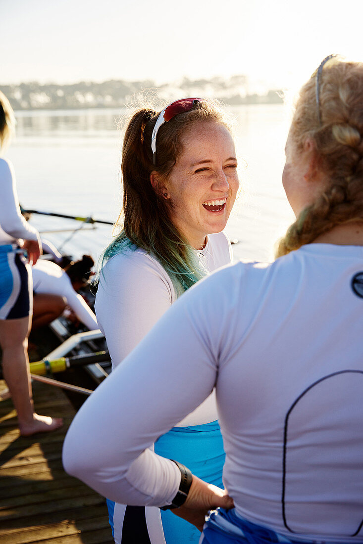 Female rowers smiling and talking