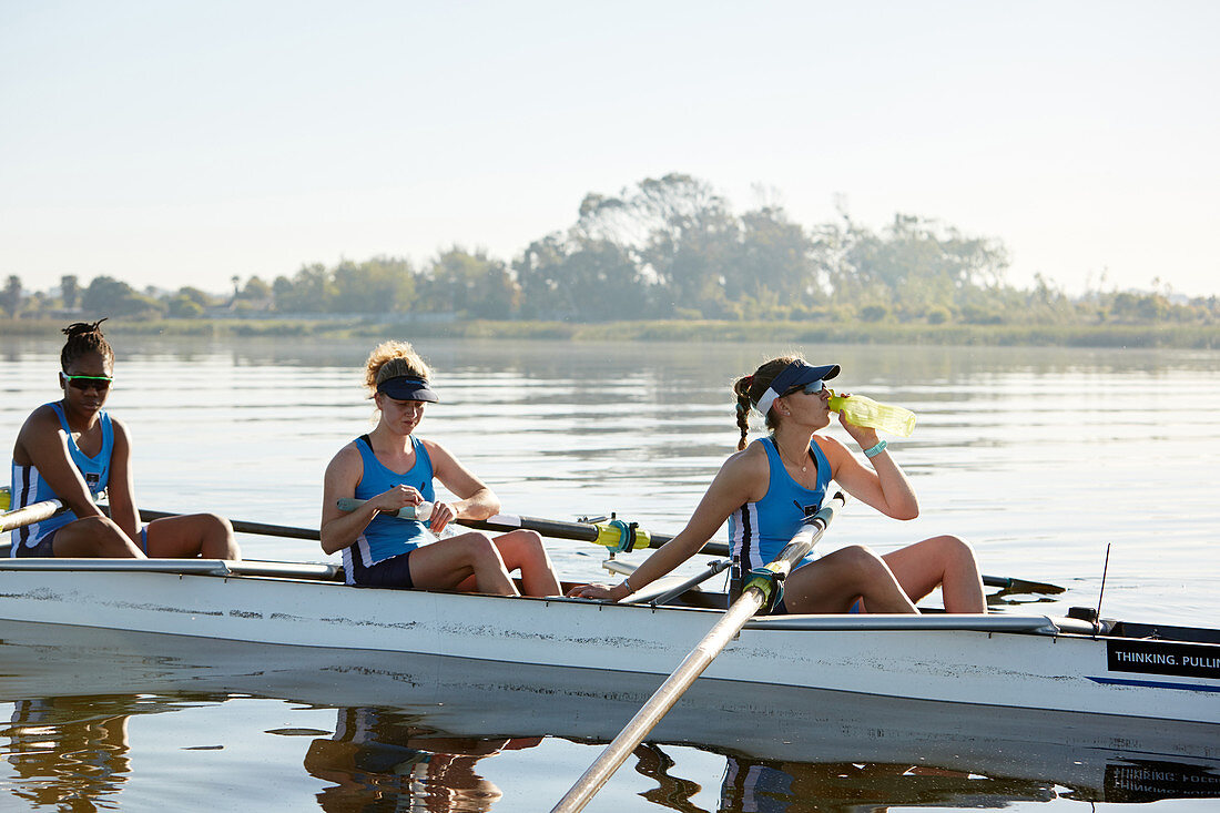 Female rowing team resting