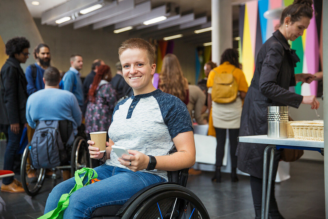 Portrait woman in wheelchair at conference