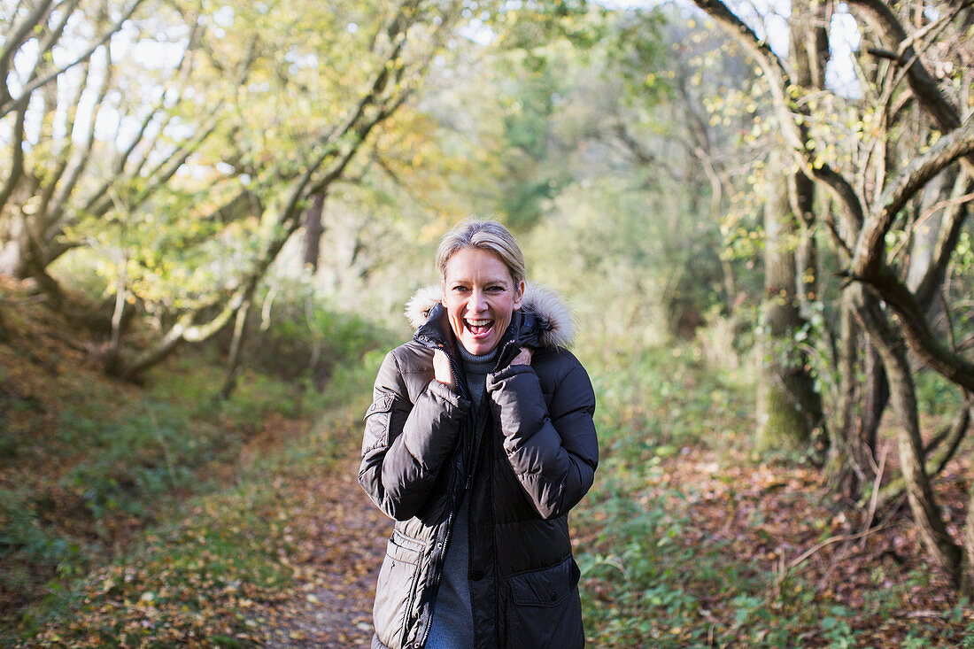 Mature woman in autumn woods