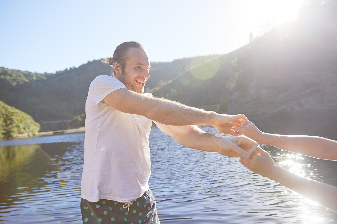 Playful couple holding hands