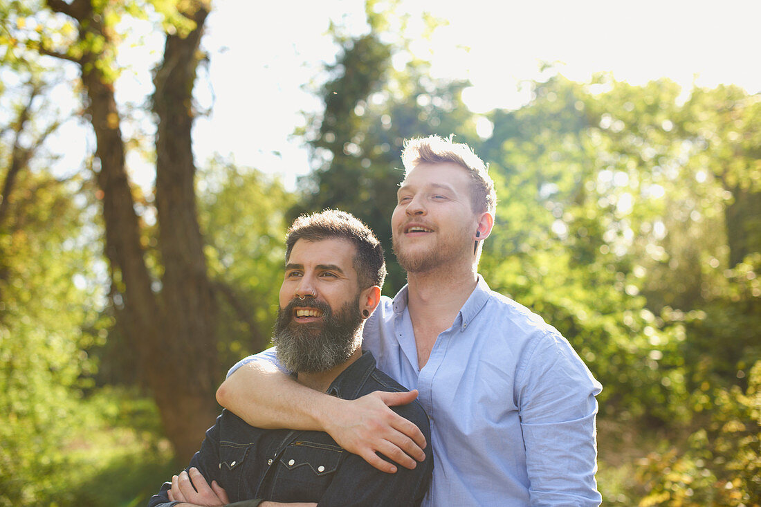 Affectionate male gay couple hugging